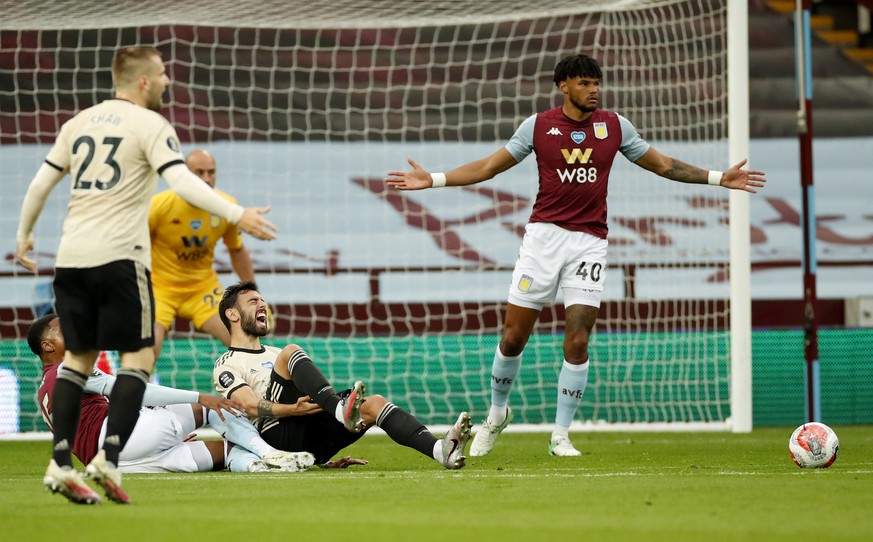 Manchester United&#039;s Bruno Fernandes reacts as he is fouled in the penalty box during the English Premier League soccer match between Aston Villa and Manchester United at Villa Park in Birmingham, ...