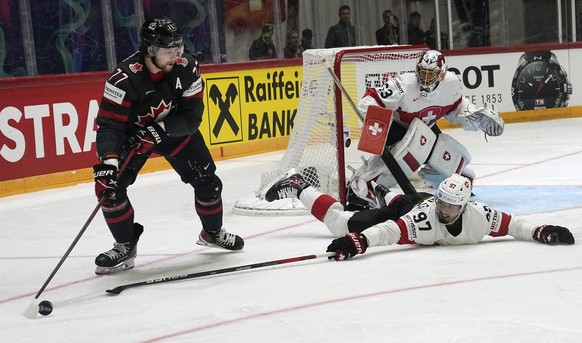 Canada&#039;s Canada&#039;s Josh Anderson is challenged by Jonas Siegenthaler from Switzerland during the group A Hockey World Championship match between Canada and Switzerland in Helsinki, Finland, S ...