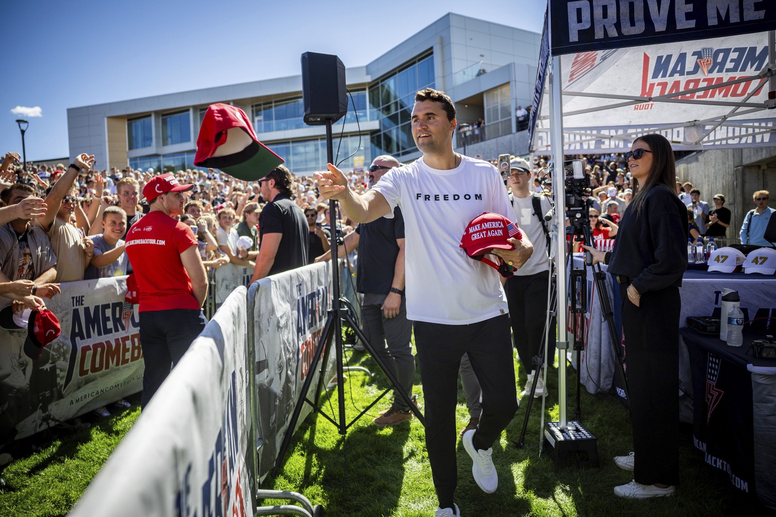 Charlie Kirk hands out hats before speaking at Utah Valley University in Orem, Utah, Wednesday, Sept. 10, 2025. (Tess Crowley/The Deseret News via AP)
Charlie Kirk shot