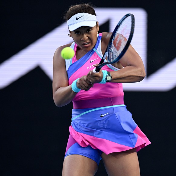 epa09699250 Naomi Osaka of Japan in action during her third round Women?s singles match against Amanda Anisimova of the USA on Day 5 of the Australian Open Tennis Tournament at Melbourne Park in Melbo ...