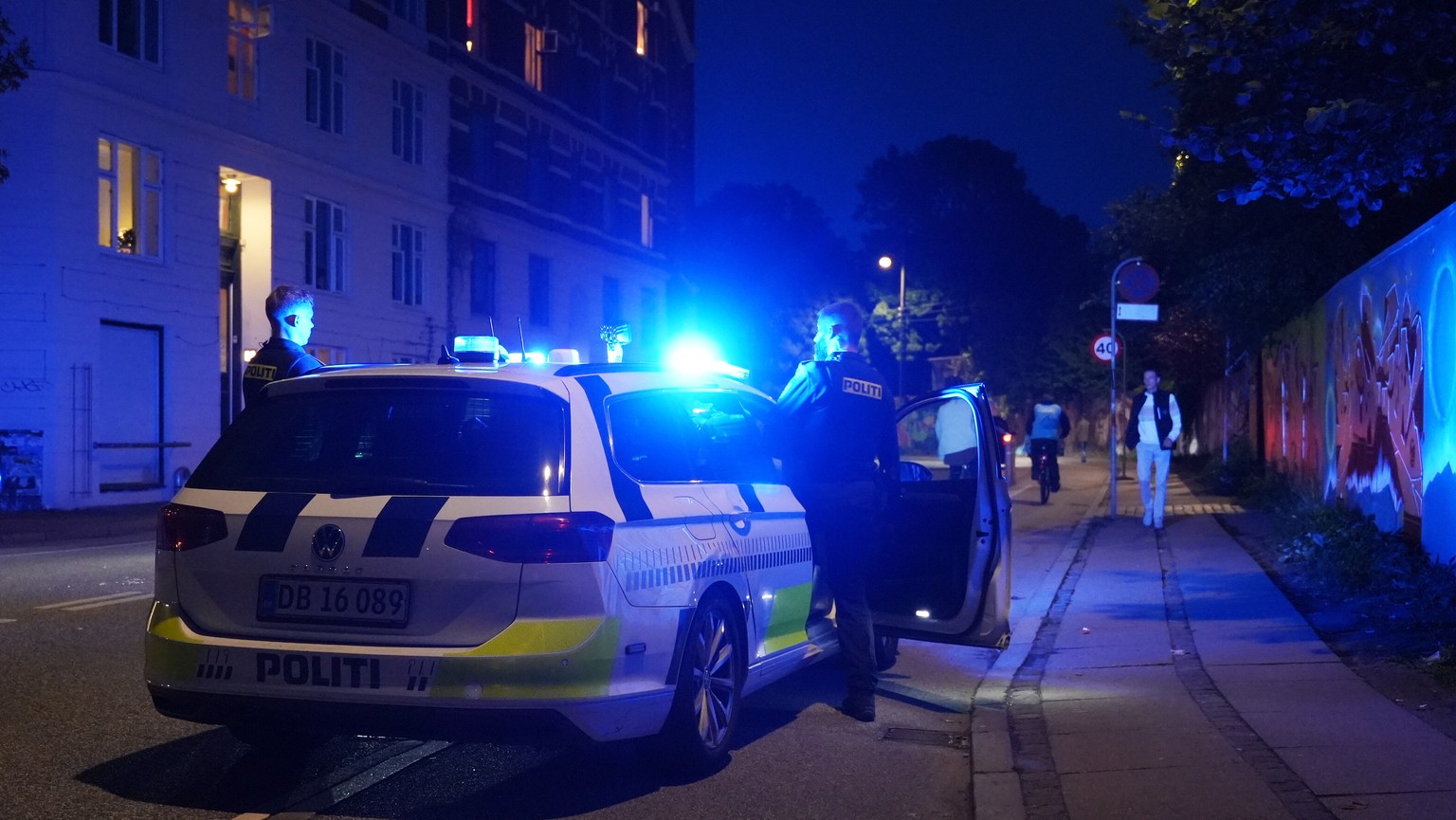 Police work in the Freetown Christiania neighborhood of Copenhagen, Denmark, Saturday, Aug. 26, 2023. Police said two masked gunmen opened fire inside a building in the neighborhood, known for its cou ...