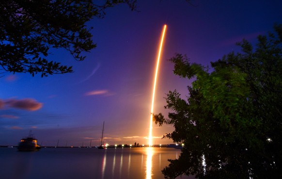 The launch of a SpaceX Crew Dragon capsule atop a Falcon 9 rocket is seen after taking off from Pad 39A at Kennedy Space Center in Cape Canaveral, Fla., late Wednesday, Sept. 15, 2021, with an all-ama ...