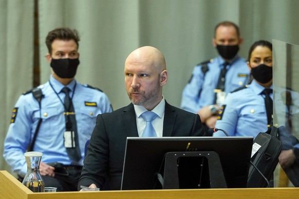 Norwegian mass killer Anders Behring Breivik sits in the makeshift courtroom in Skien prison on the second day of his hearing where he is requesting release on parole, in Skien, Norway, Wednesday, Jan ...