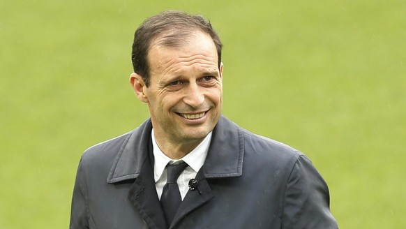 Juventus&#039; head coach Massimiliano Allegri walks along the pitch at the Santiago Bernabeu stadium in Madrid, Tuesday, April 10, 2018. Juventus will play a Champions League quarter final second leg ...