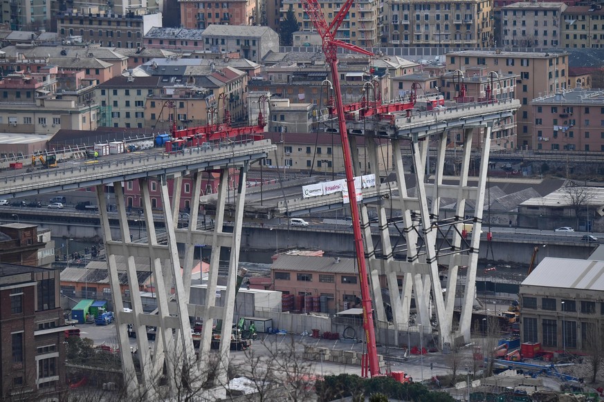 epaselect epa07354564 A general view of the ongoing demolition works on the Morandi bridge in Genoa, Italy, 09 Februay 2019. The Morandi bridge partially collapsed on 14 August 2018 killing 43 people. ...