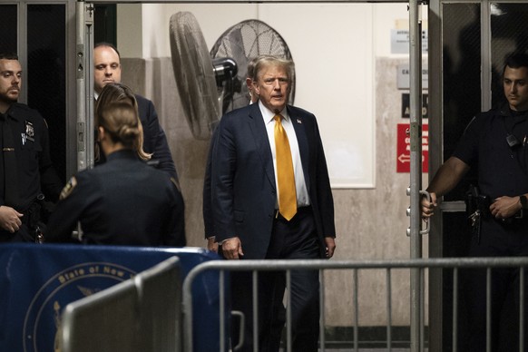 Former US President Donald Trump walks to courtroom at Manhattan criminal court in New York, Wednesday, May 29, 2024, in New York. (Yuki Iwamura/Pool Photo via AP)