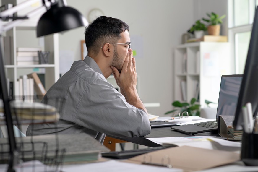 Businessman looking stressed from work, Businessman working at office feels overworked and burnout