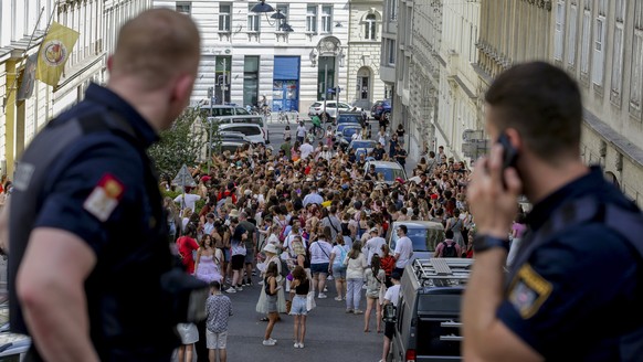 Austrian police officers watch swifts gathering in the city centre in Vienna on Thursday, Aug.8, 2024. Organizers of three Taylor Swift concerts in the stadium in Vienna this week called them off on W ...