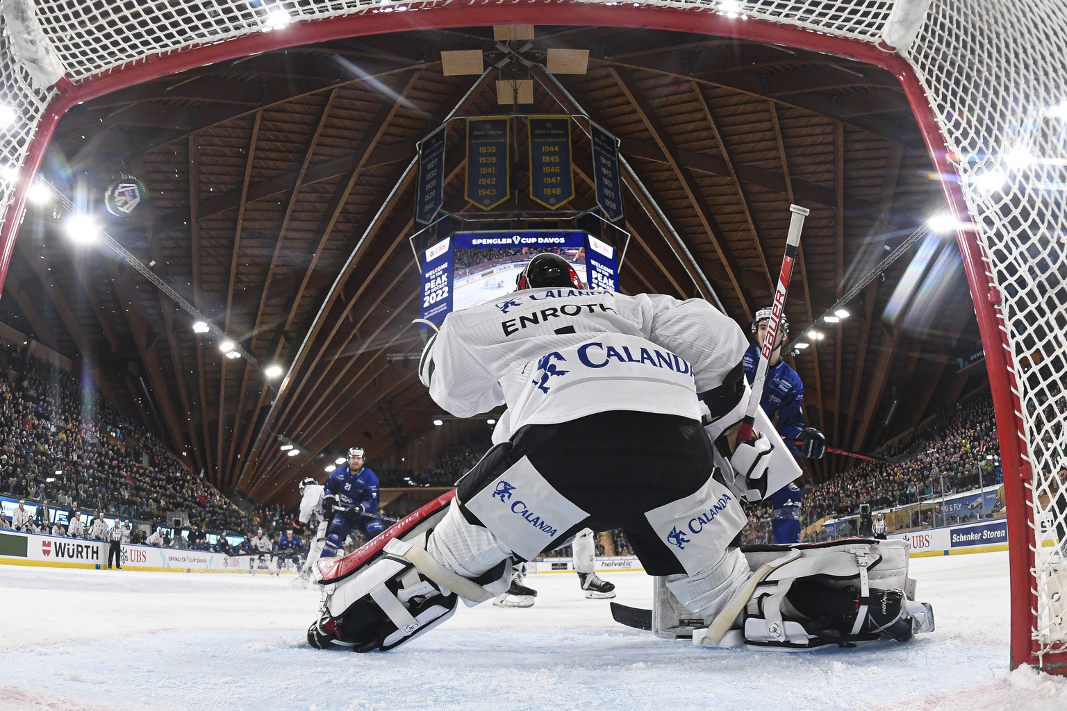 Ambri&#039;s Brandon McMillan scores against Oerebro&#039;s goalkeeper Jhonas Enroth during the game between Switzerland&#039;s HC Ambri-Piotta, and Swedens Oerebro HK, at the 94th Spengler Cup ice ho ...
