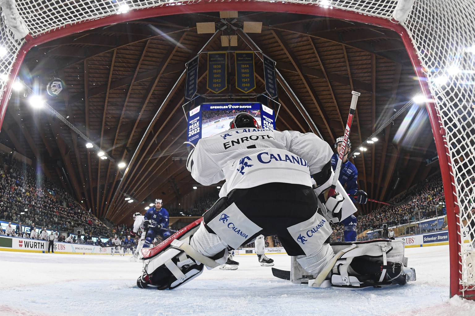 Ambri&#039;s Brandon McMillan scores against Oerebro&#039;s goalkeeper Jhonas Enroth during the game between Switzerland&#039;s HC Ambri-Piotta, and Swedens Oerebro HK, at the 94th Spengler Cup ice ho ...