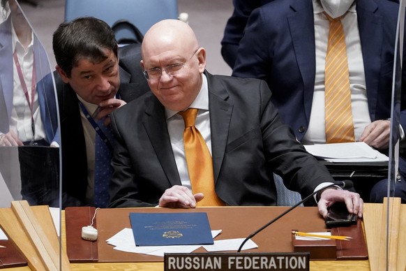 Vasily Nebenzya, Permanent Representative of Russia to the United Nations, smiles as he arrives to a UN Security Council Meeting on Food Insecurity and Conflict, Thursday, May 19, 2022, at United Nati ...