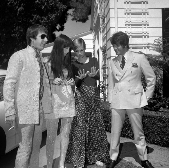 Sonny Bono, Cher, Twiggy and Justin de Villeneuve (Twiggy s boyfriend and manager), at a party held at the house of Sonny and Cher on May 15, 1967 in Beverly Hills, California.� JRC /The Hollywood Arc ...