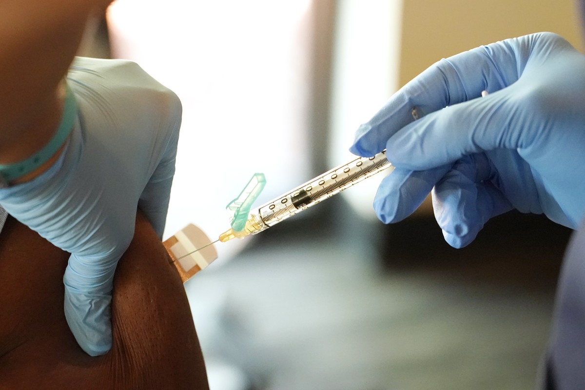 A resident receives a Moderna COVID-19 vaccination from a Jackson-Hinds Comprehensive Health Center nurse at an inoculation station next to Jackson State University in Jackson, Miss., Tuesday, July 19 ...