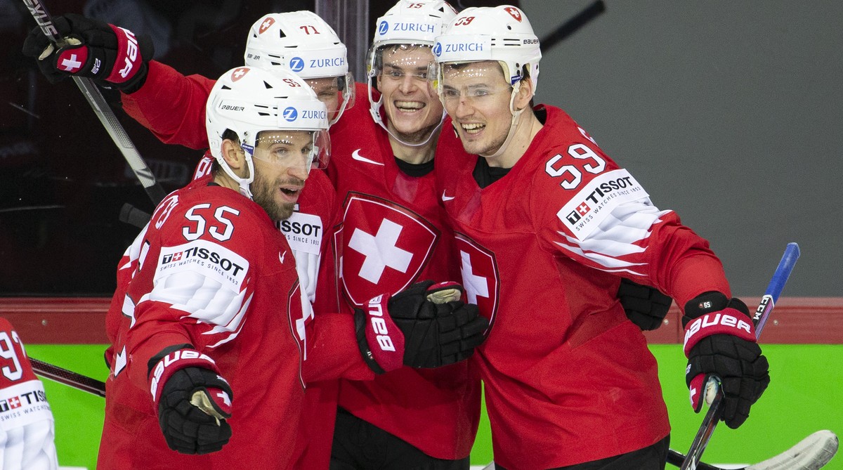 Switzerland's forward Gregory Hofmann, 2nd right, celebrates his goal with teammates defender Romain Loeffel #55, forward Enzo Corvi #71 and forward Dario Simion, right, after scoring the 4:0 dur ...