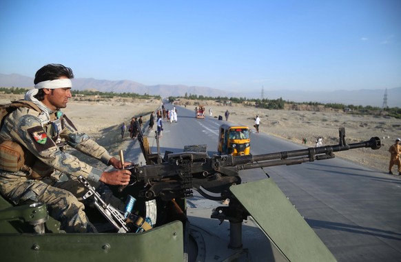 epa09195876 Afghan security officials check vehicles at a check point as people celebrate the Eid al-Fitr, which marks the end of Ramadan, in Jalalabad, Afghanistan, 13 May 2021. The Taliban on 10 May ...