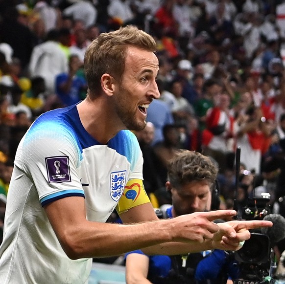 epaselect epa10348648 Harry Kane of England celebrates scoring the 2-0 lead during the FIFA World Cup 2022 round of 16 soccer match between England and Senegal at Al Bayt Stadium in Al Khor, Qatar, 04 ...
