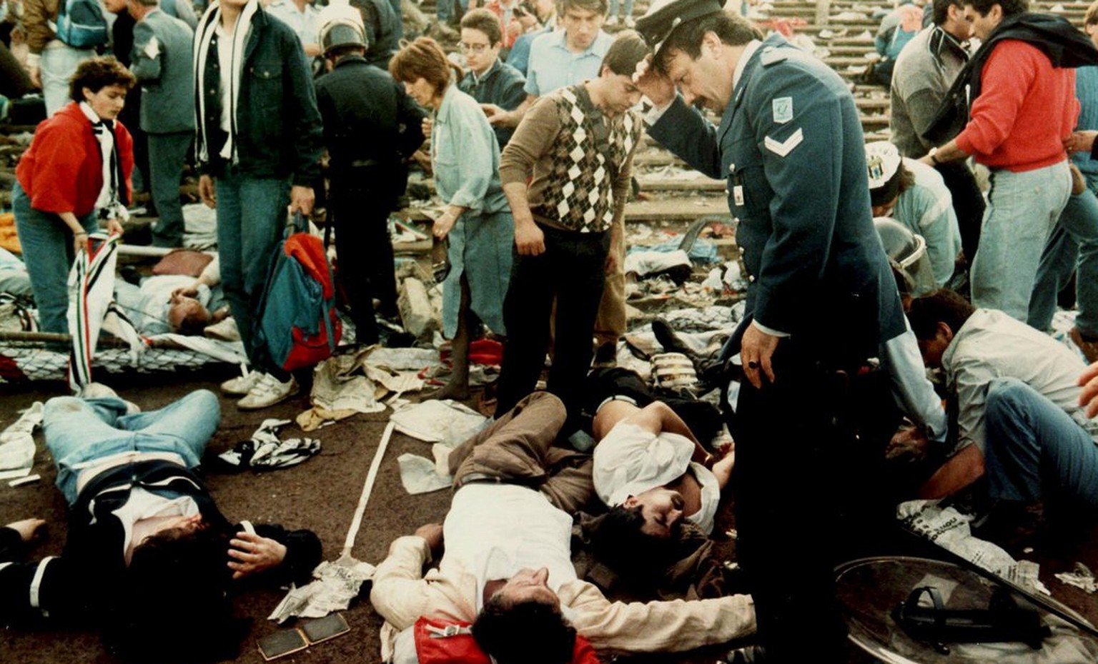 Photo dated 29 May 1985 shows injured spectators in the Heysel stadium in Brussels after violent clashes between Juventus Turin and Liverpool fans prior to the European Champions Cup final. The Heysel ...