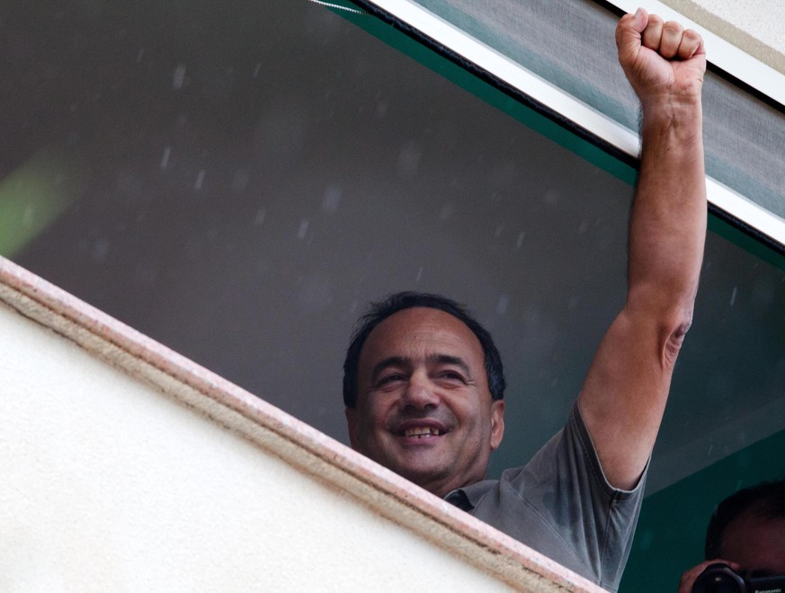 epa07074230 Domenico Lucano greets the people who came to Riace to witness their solidarity with the mayor, now suspended under house arrest for aiding illegal immigration, Riace, 06 October 2018. Dom ...