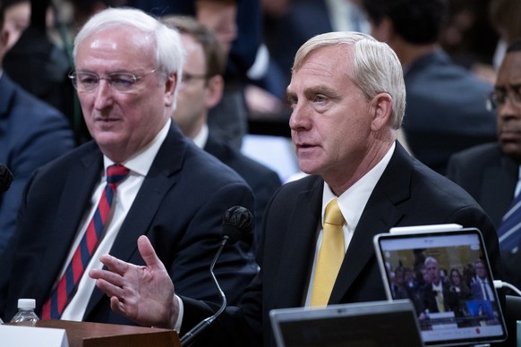 epa10030850 Former Acting Deputy Attorney General Richard Donoghue (R) and Former Acting Attorney General Jeffrey Rosen (L) testify before a public hearing of the House Select Committee to Investigate ...
