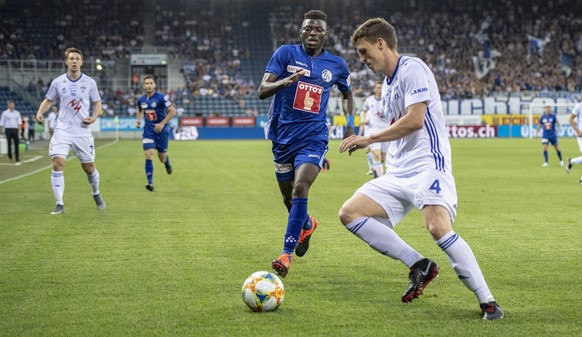 Eric Tia, left, from FC Luzern and Deni Pavlovic, right, from KI Klaksvik at the Europa League Qualification game, round 2 match between Switzerlands`s FC Luzern and Faroe Islands Team of KI Klaksvik  ...