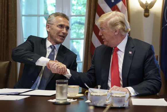 President Donald Trump and NATO Secretary General Jens Stoltenberg shake hands during a expanded bilateral meeting at the White House, in Washington, Thursday, May 17, 2018. (AP Photo/Carolyn Kaster)