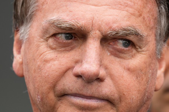 FILE - Brazil's former President Jair Bolsonaro, temporarily allowed out of house arrest for medical treatment, departs a hospital in Brasilia, Brazil, Sept. 14, 2025. (AP Photo/Eraldo Peres, Fil ...