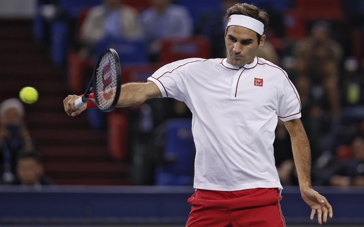 Roger Federer of Switzerland hits a return shot against David Goffin of Belgium during their men's singles match at the Shanghai Masters tennis tournament at Qizhong Forest Sports City Tennis Cen ...