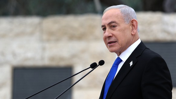 FILE - Israel's Prime Minister Benjamin Netanyahu attends a ceremony at the Military Cemetery on Mount Herzl in Jerusalem, April 21, 2026. (Ilia Yefimovich/Pool Photo via AP, File)
Israel Politic ...