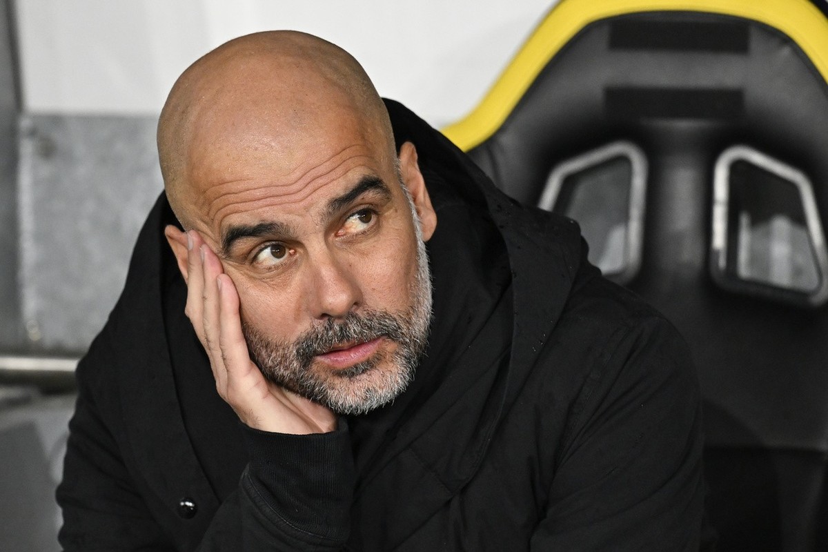 Manchester City's head coach Josep Guardiola looks on ahead of the UEFA Champions League group G soccer match between Switzerland's BSC Young Boys and England's Manchester City Football ...