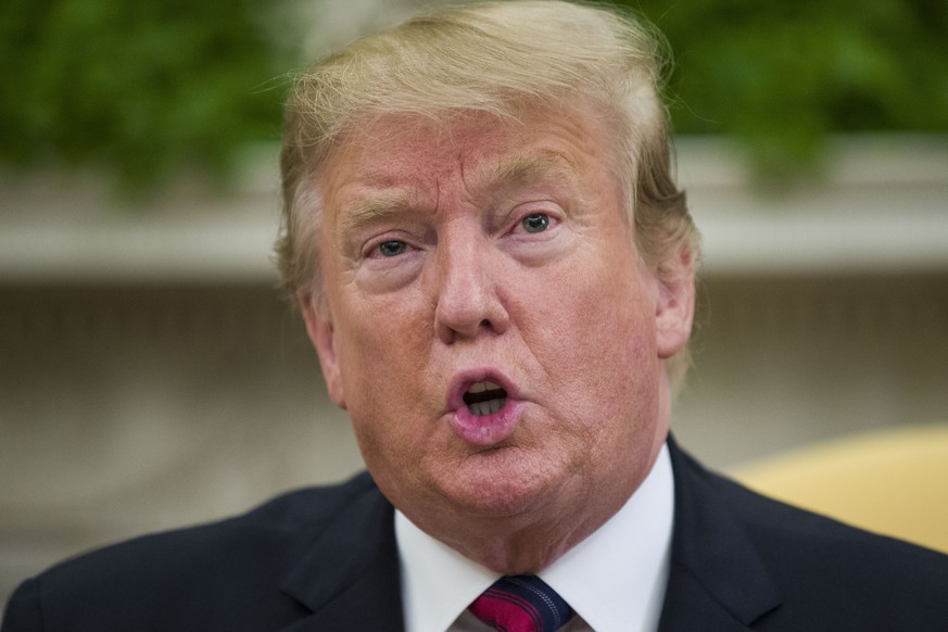 FILE - In this Friday, May 3, 2019 file photo, President Donald Trump speaks during a meeting in the Oval Office of the White House, in Washington. Trump issued an executive order Wednesday, May 15, 2 ...