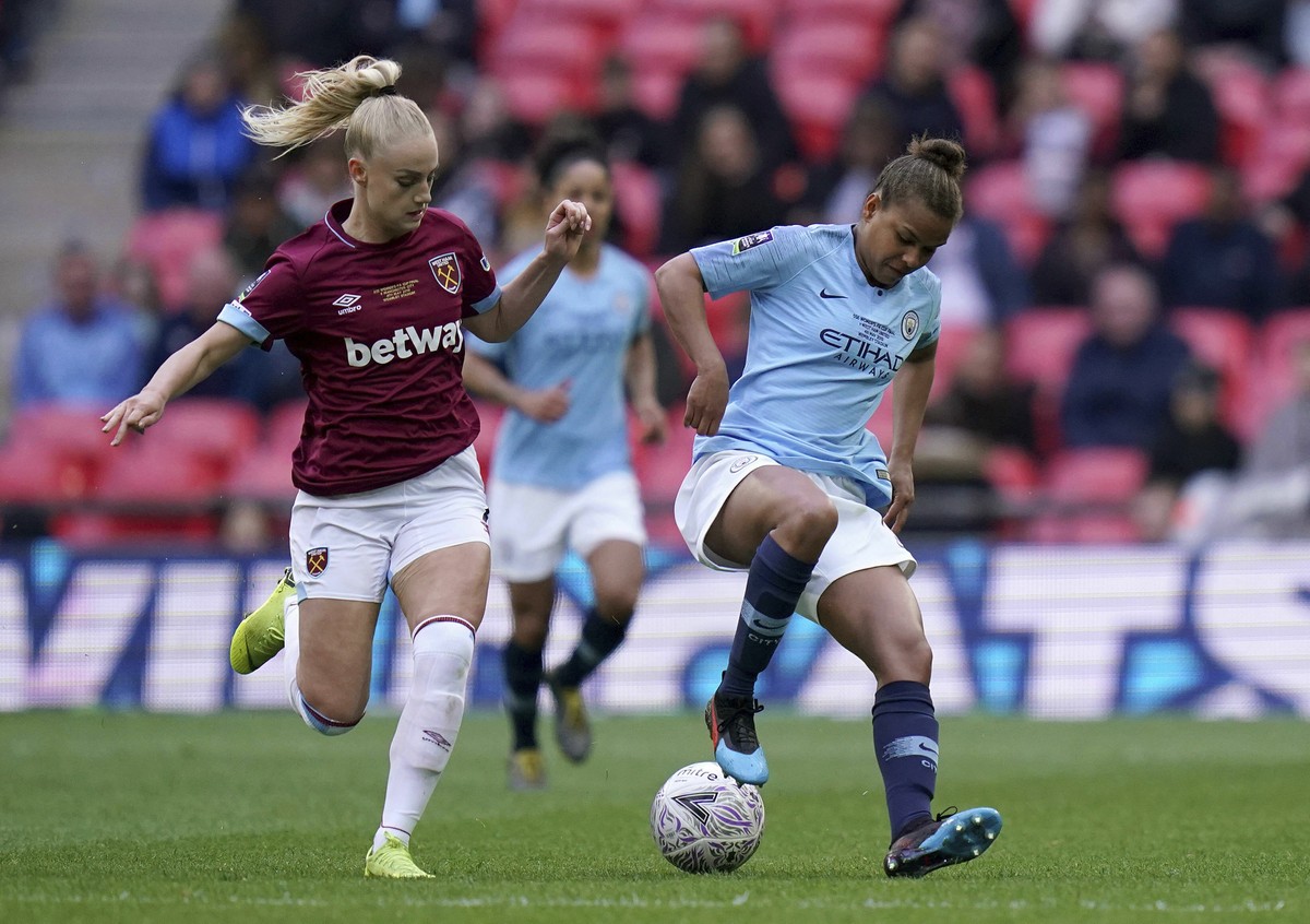 West Ham's Alisha Lehmann, left, and Manchester City's Nikita Parris battle for the ball during the Women's FA Cup Final at Wembley Stadium, London, Saturday May 4, 2019. (John Walton/P ...