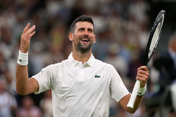 Novak Djokovic of Serbia celebrates winning the men's singles match against Yibing Wu of China at the Wimbledon Tennis Championships in London, Monday, June 29, 2026.(AP Photo/Kin Cheung)
Novak D ...