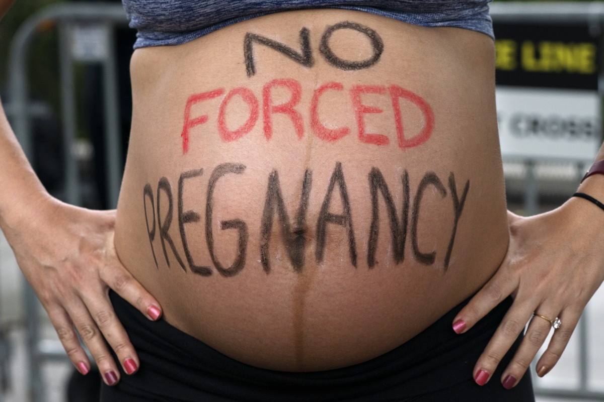 FILE - Krista Bywater shows her eight-months-pregnant belly during an abortion advocacy rally outside the Supreme Court, May 14, 2022, in Washington. (AP Photo/Jacquelyn Martin, File)
Krista Bywater