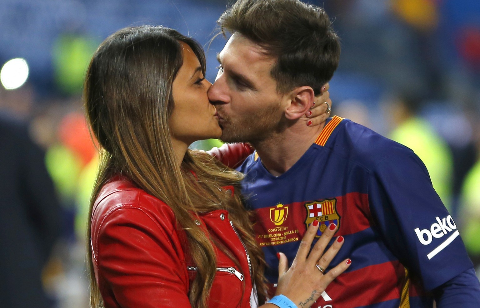 FILE - This is a Sunday, May 22, 2016 file photo of Barcelona&#039;s Lionel Messi, kisses his girlfriend Antonella Roccuzzo as they celebrate after winning the final of the Copa del Rey soccer match b ...