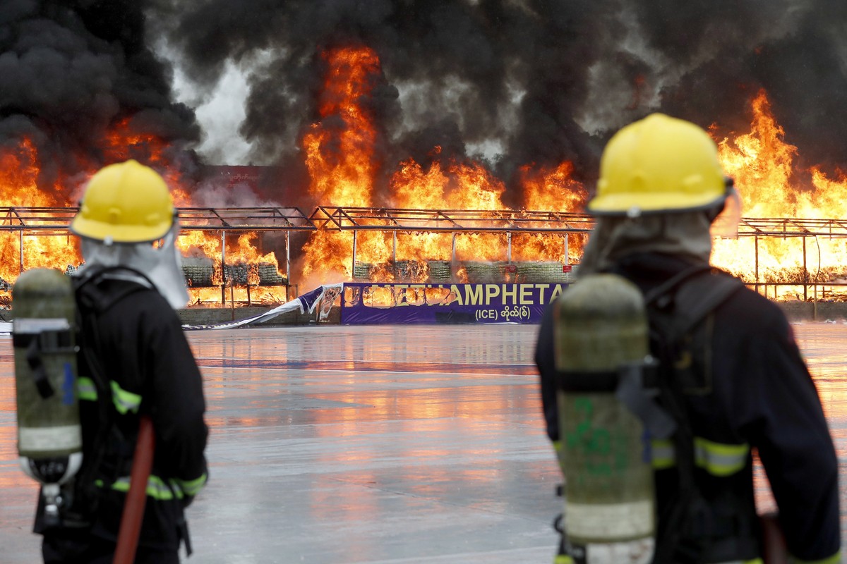 epa10711590 Firefighters standby near a burning pile of illegal drugs during a 'Destruction Ceremony of Seized Narcotic Drugs' held to mark the International Day Against Drug Abuse and Illic ...
