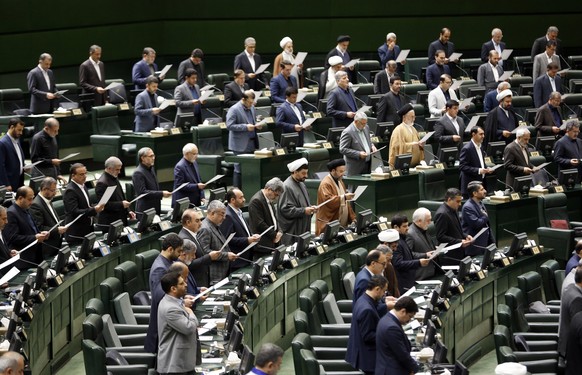epa11373166 Iranian lawmakers are sworn-in during the New Iranian parliament inauguration ceremony at the parliament in Tehran, Iran, 27 May 2024. The opening ceremony of the 12th term of the Iranian  ...