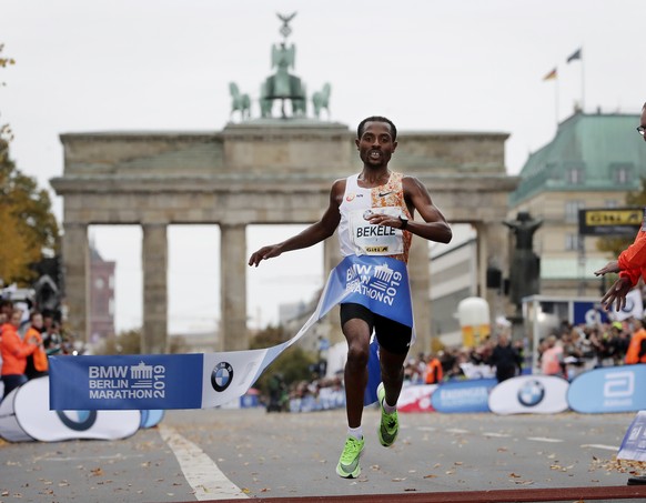 Ethiopia&#039;s Kenenisa Bekele crosses the finish line to win the 46th Berlin marathon in Berlin, Germany, Sunday, Sept. 29, 2019. (AP Photo/Michael Sohn)