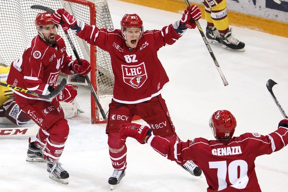 Lausanne&#039;s center Etienne Froidevaux, left, celebrates his goal with teammates Lausanne&#039;s forward Harri Pesonen, of Finland, center, and defender Joel Genazzi, right, after scoring the 3:2,  ...