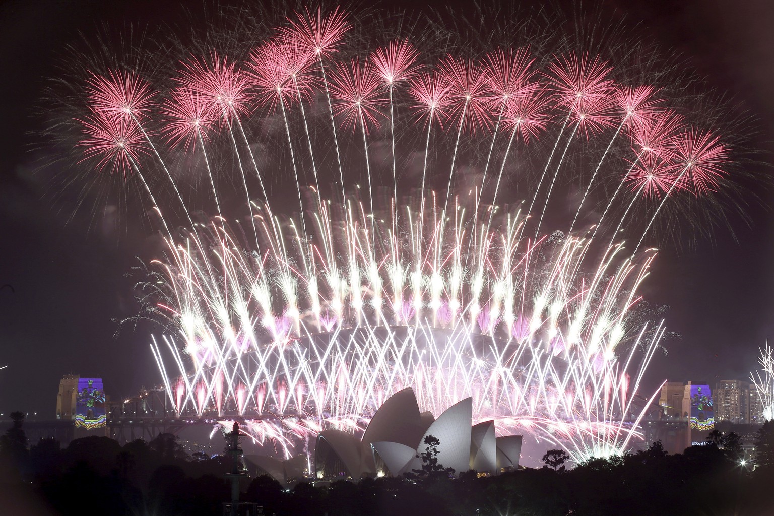 FILE - In this Jan. 1, 2017, file photo, fireworks explode over the Sydney Opera House and Harbour Bridge as New Year&#039;s celebrations are underway in Sydney. Australia&#039;s Prime Minister Scott  ...