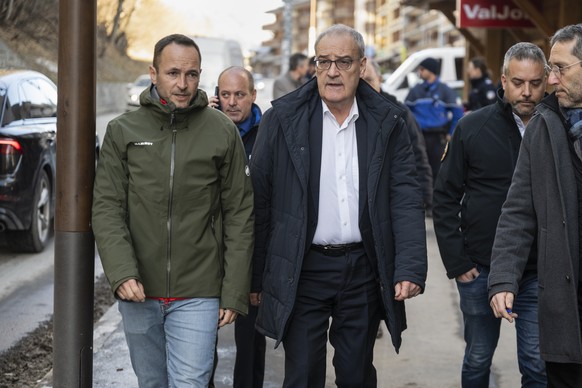 Swiss Federal President Guy Parmelin, Mathias Reynard, State Councillor and president of the Council of State of the Canton of Valais, and Stephane Ganzer, State Councillor and head of the Department  ...