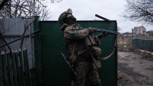 In this photo provided by Ukraine's 93rd Kholodnyi Yar Separate Mechanized Brigade press service, a soldier watches for Russian FPV drones on the frontline near Kostyantynivka, Donetsk region, Uk ...