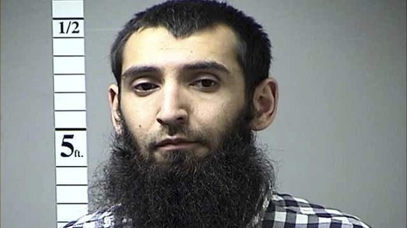 This undated photo provided by St. Charles County Department of Corrections via KMOV shows the Sayfullo Saipov. A man in a rented pickup truck mowed down pedestrians and cyclists along a busy bike pat ...