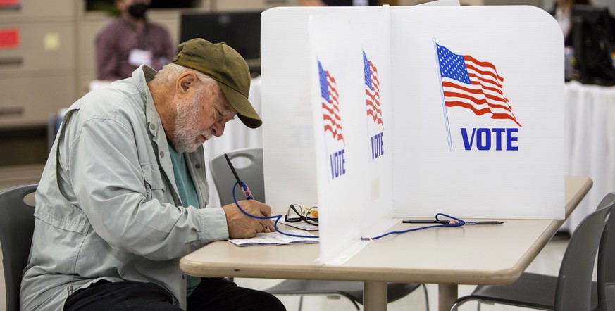 FILE - Voters cast their ballots on Sept. 23, 2022, in Minneapolis. The upcoming midterm elections could give the stock market a sorely needed boost by eliminating at least some of the uncertainty tha ...