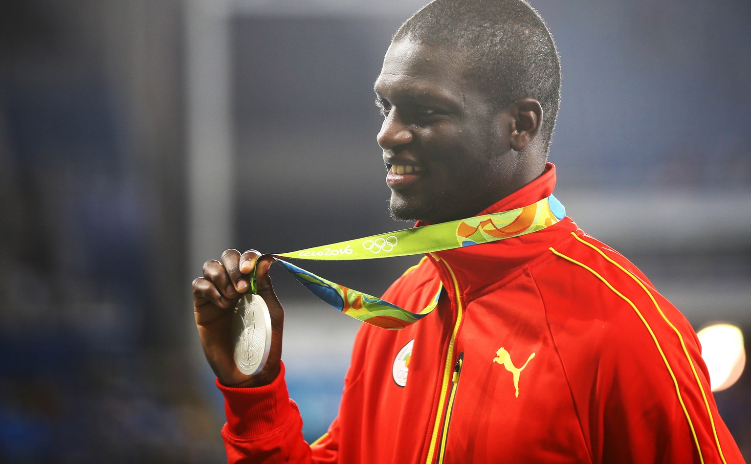 2016 Rio Olympics - Athletics - Victory Ceremony - Men&#039;s 400m Victory Ceremony - Olympic Stadium - Rio de Janeiro, Brazil - 15/08/2016. Silver medalist Kirani James (GRN) of Grenada reacts after  ...