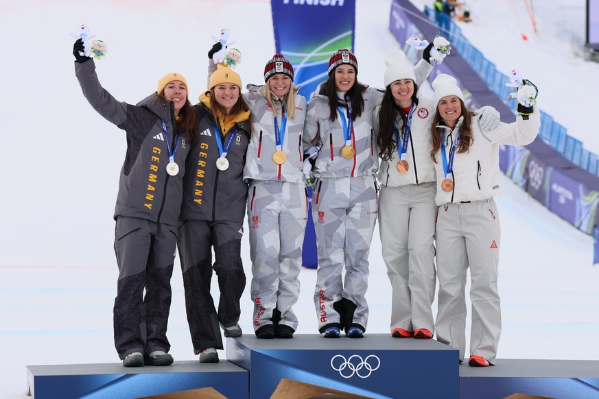epa12723798 (L-R) Silver medalist Kira Weidle-Winkelmann and Emma Aicher of Germany, gold medalist Ariane Raedler and Katharina Huber of Austria, and bronze medalist Paula Moltzan and Jacqueline Wiles ...