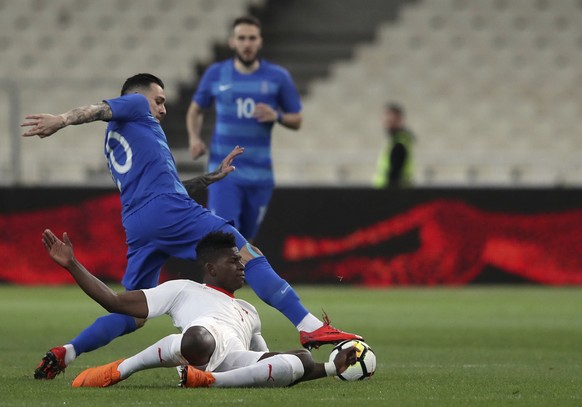 Switzerland&#039;s Breel Embolo, front, duels for the ball with Greece&#039;s Tasos Donis during an international friendly soccer match between Greece and Switzerland at the Olympic stadium in Athens, ...