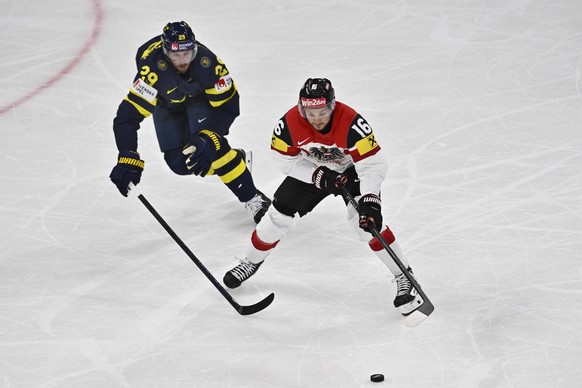 Sweden&#039;s Marcus Pettersson and Austria&#039;s Dominic Zwerger, right, in action during the IIHF Ice Hockey World Championship group A match between Sweden and Austria at Avicii Arena in Stockholm ...