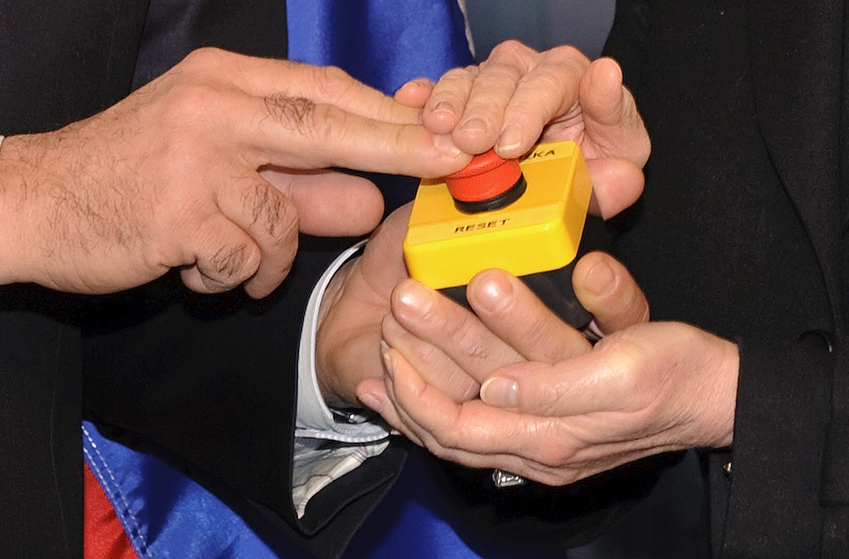 FILE - In this March 6, 2009, file pool photo, then-Secretary of State Hillary Clinton and Russian Foreign Minister Sergei Lavrov hold together a device a with a red button symbolizing the intention t ...