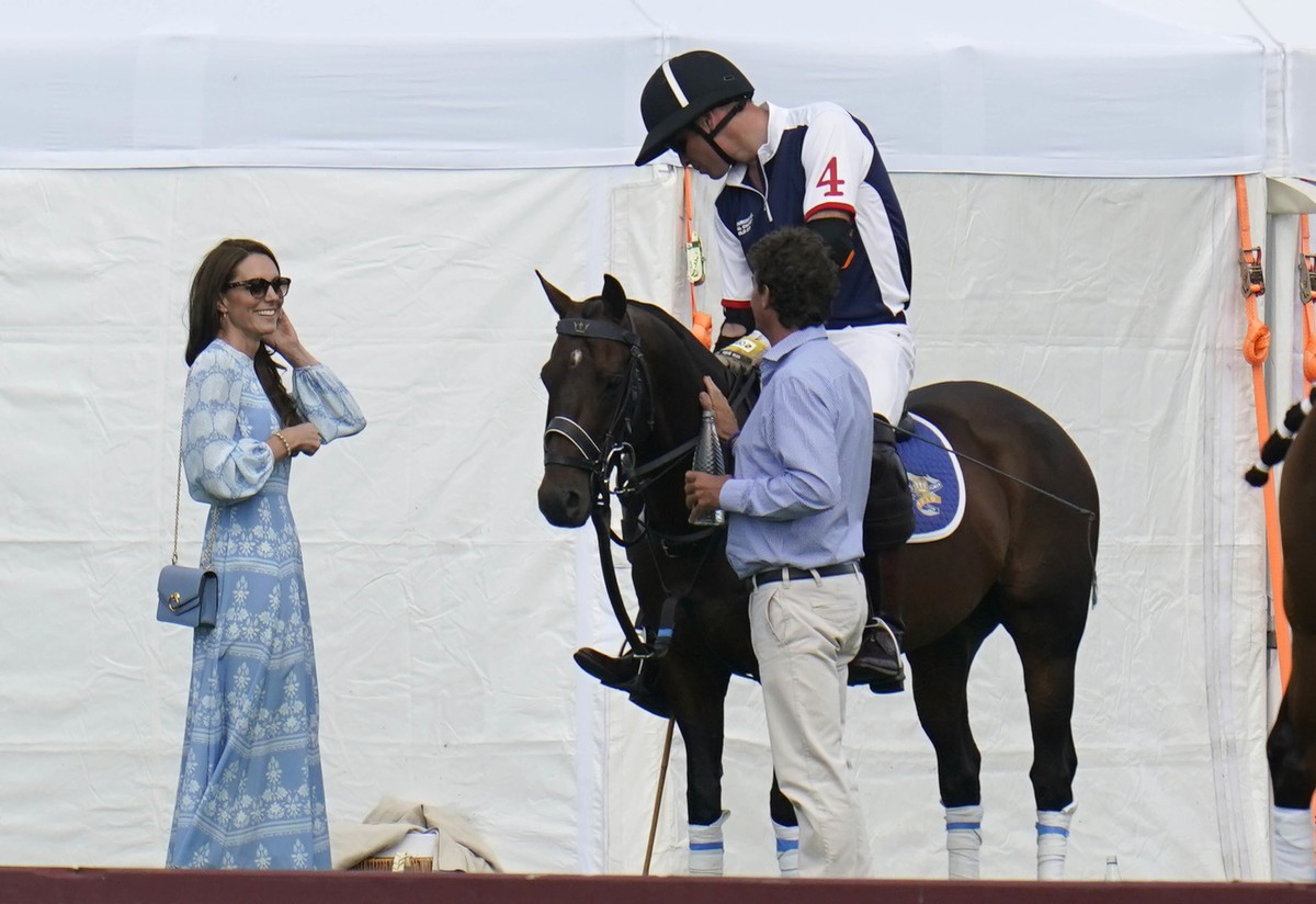 Britain's Prince William and Kate, Princess of Wales, left, at the Out-Sourcing Inc Royal Charity Polo Cup 2023 at Guards Polo Club, Windsor, England, Thursday, July 6, 2023, which raises funds a ...