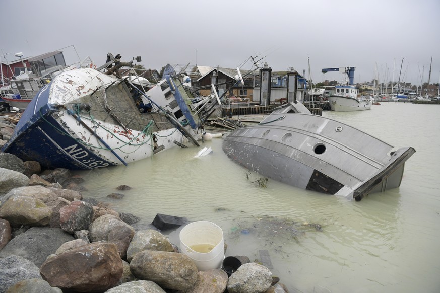 epa10930543 Damaged boats after Storm Babet hit Roedvig on Stevns Island, Denmark, 21 October 223. Storm Babet sweeps across northern parts of Europe, including Great Britain, Denmark, Sweden, Norway  ...